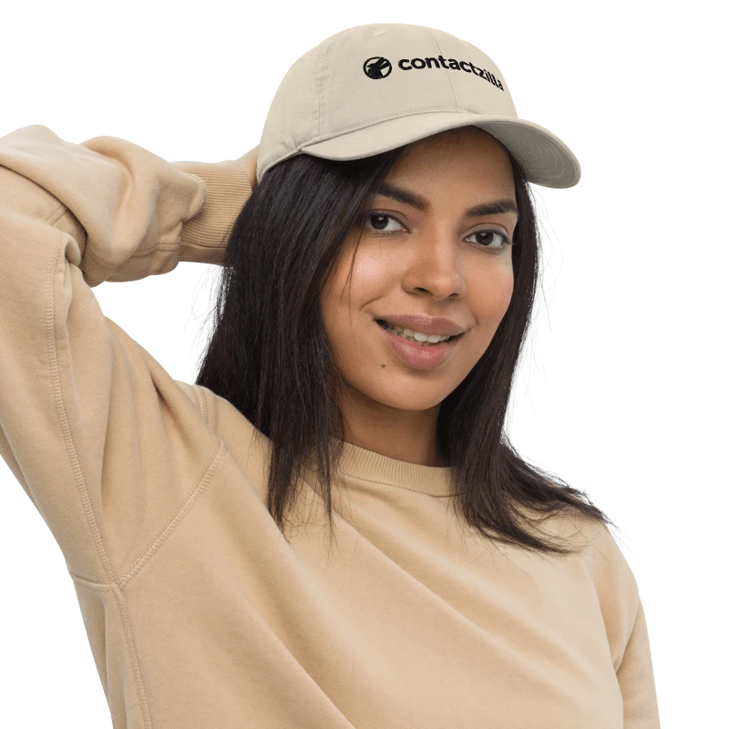 A woman wearing a Contactzilla cap.